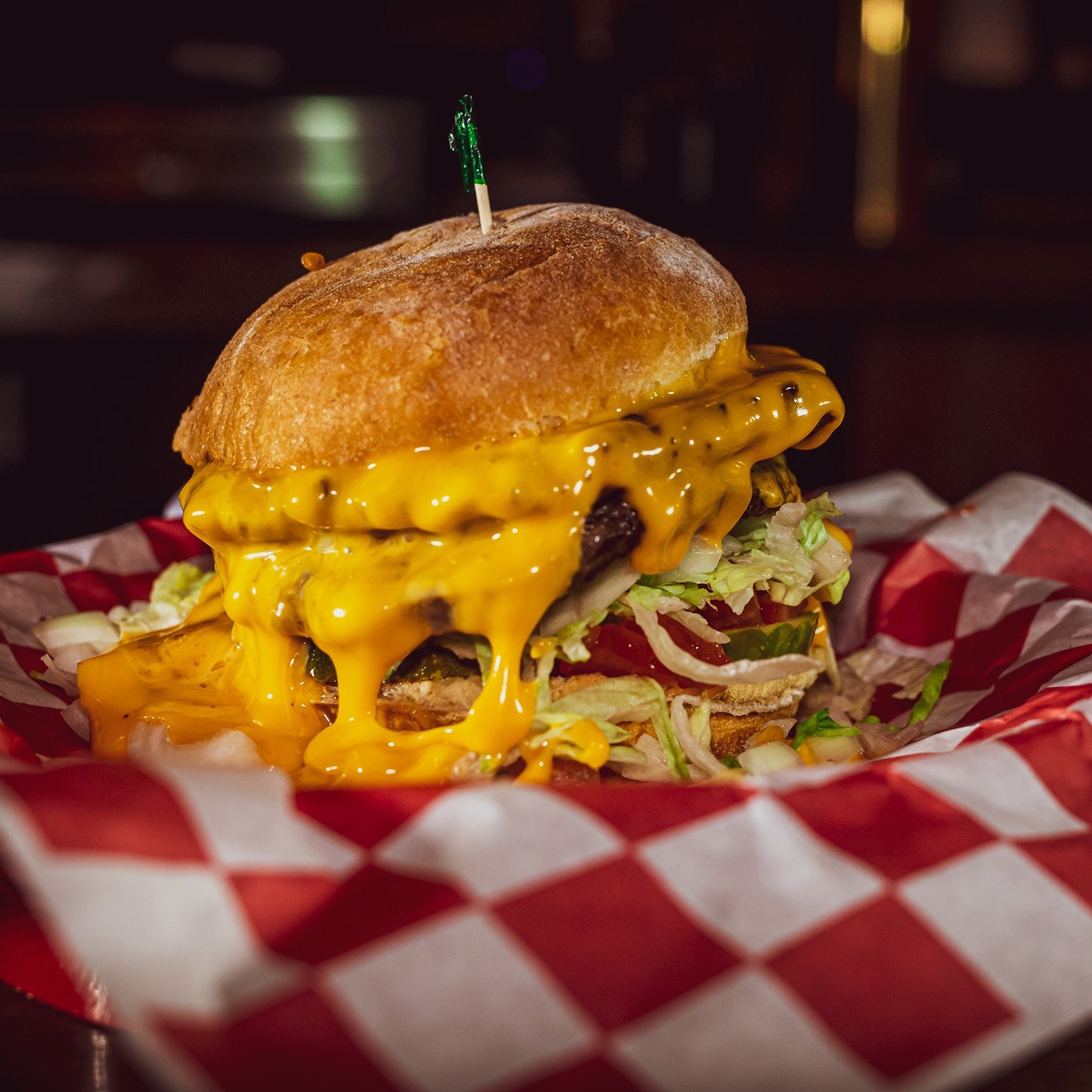 Double cheeseburger close-up in a checkered basket